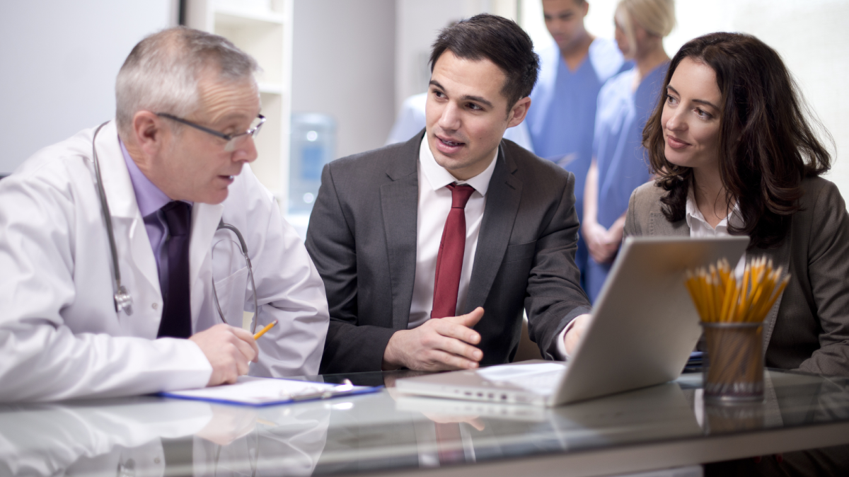 Group of hospital leaders discussing hospital strategy